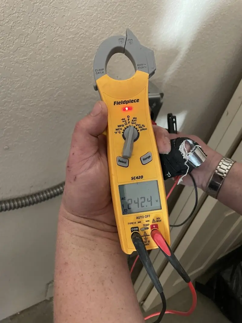 Voltage testing with clamp meter during Electrical Installation Services in Milledgeville
